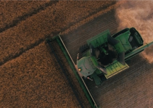 Tractor plowing field top view