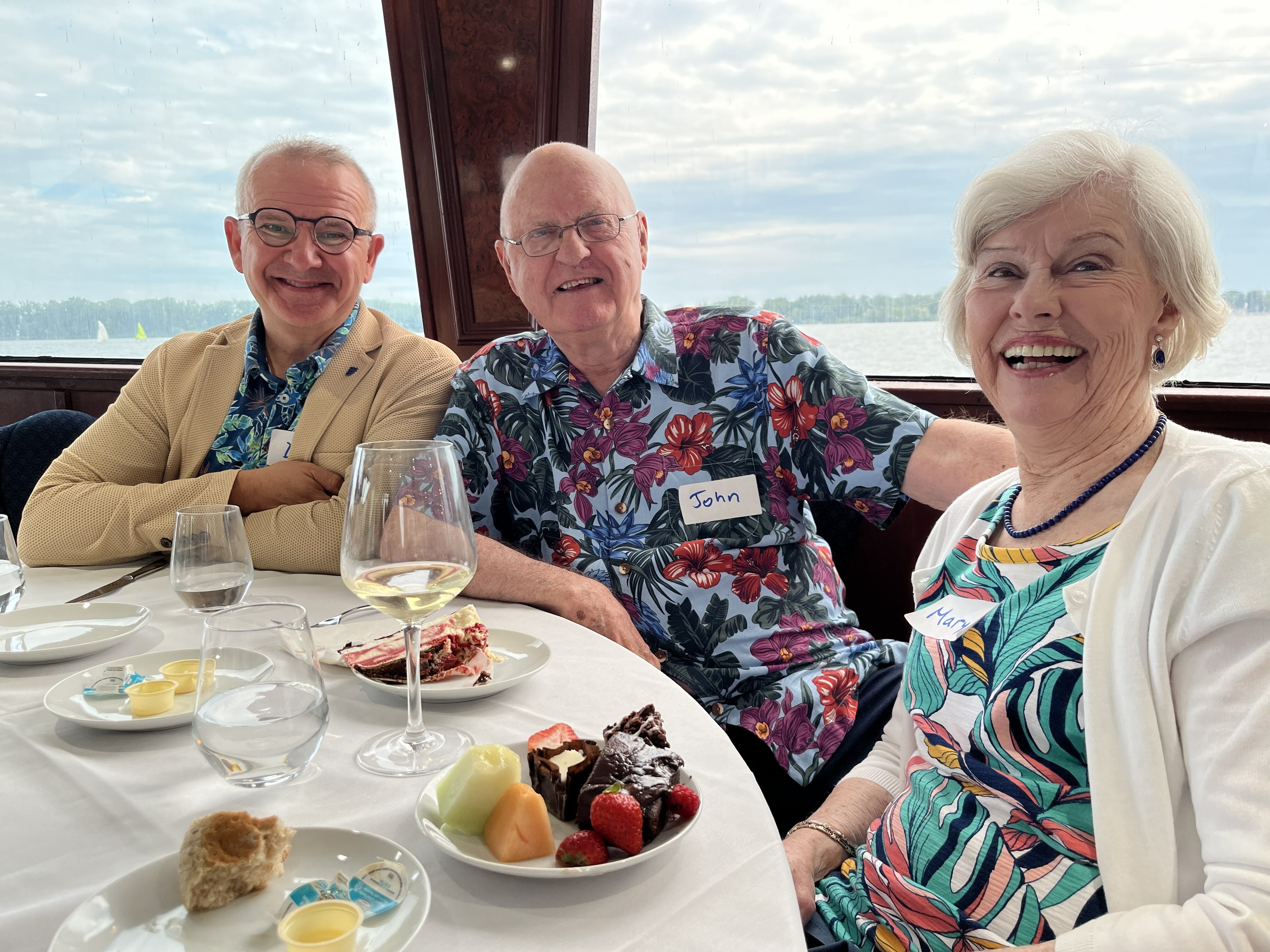 John and Mary Bulloch with Dan Kelly seated at a dinner table