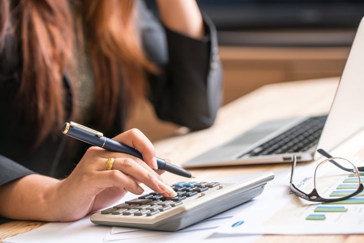 Woman using a calculator