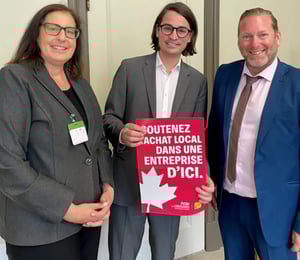 Corinne Pohlmann, Jasmin Guénette and Jean-Denis Garon holding a CFIB poster