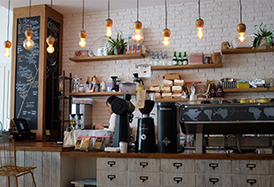 Image of a coffee shop counter and barista