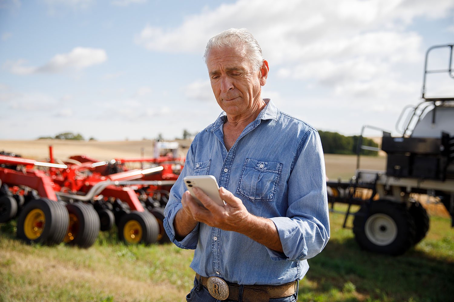 Farmer looking at his phone