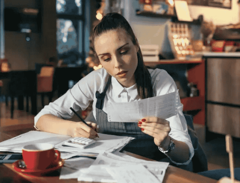 Small business owner checking her financial and tax documents