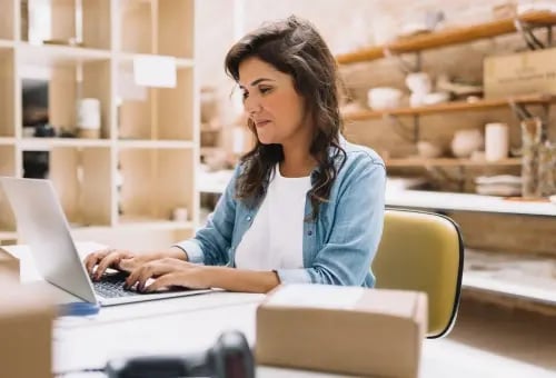 Small business owner working in her store