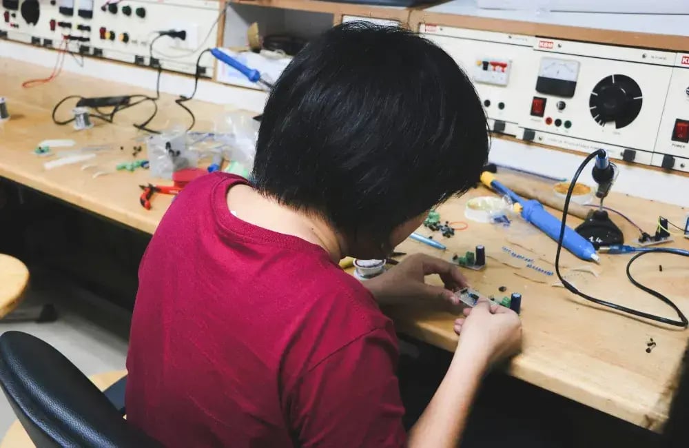 Small business owner repairing an appliance