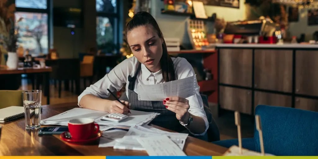 Small business owner checking her financial and tax documents