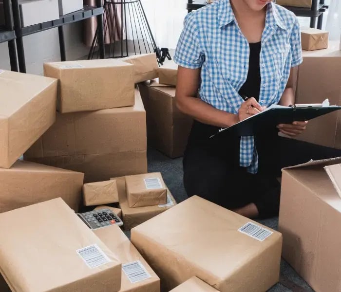 Small business owner preparing packages for shipping