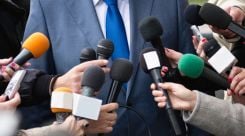 media centre with microphones and man