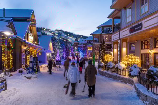 People strolling the Blue Mountain Village at night 