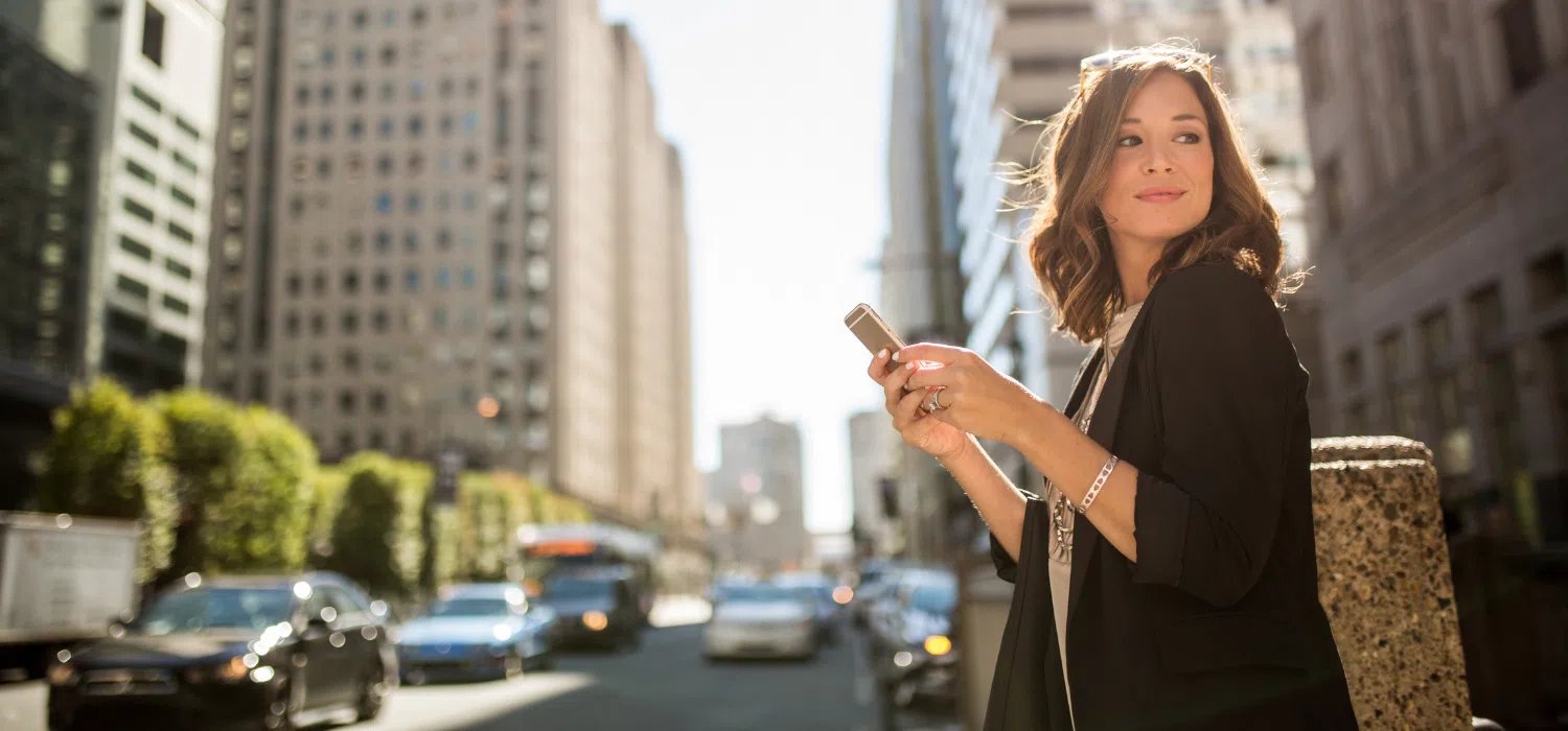 Small business owner using her cellphone