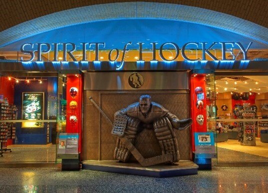 Spirit of Hockey sign above the statue of a hockey player
