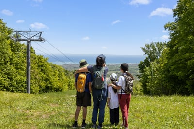 Family standing on top of Blue Mountain