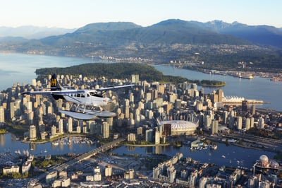Harbour Air seaplane flying over the North Shore Mountains