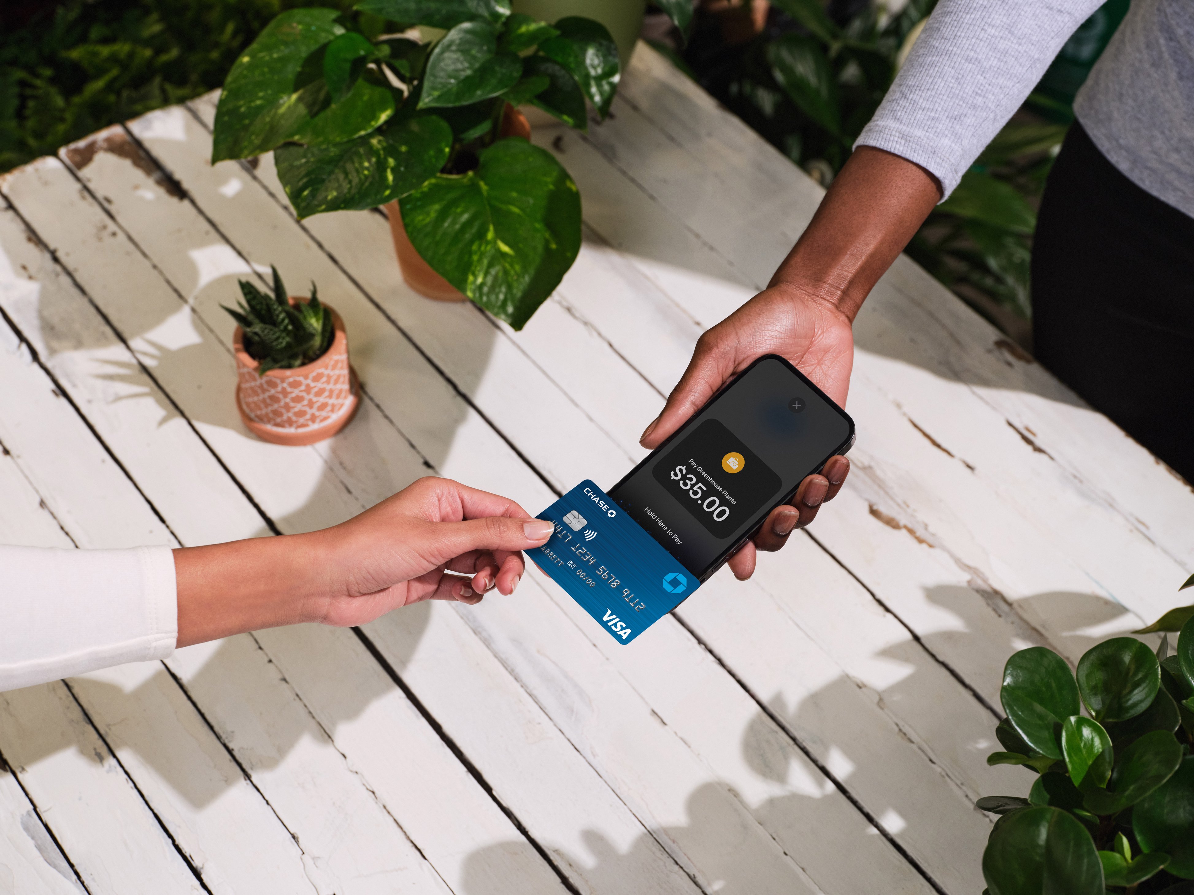 Customer tapping their card on a Chase terminal.