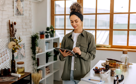 Business owner scrolling on her tablet