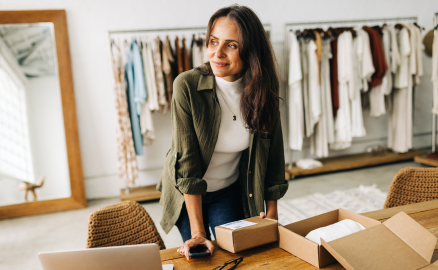 Small business owner packing customer orders