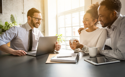 Insurance broker meeting with two business owners
