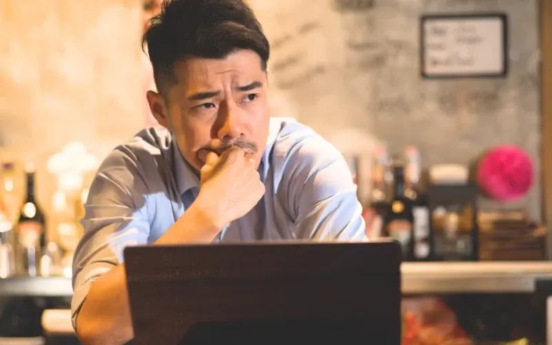 Stressed small business owner in his shop