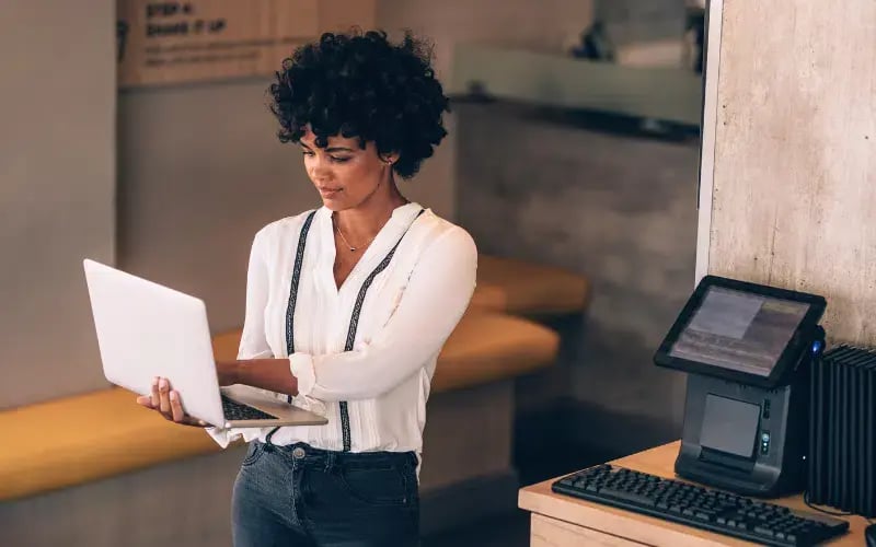 Small business owner looking at her laptop