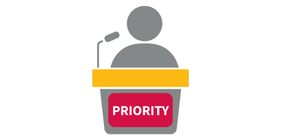 A matchstick figure on a podium with the word 'priority' written on the podium