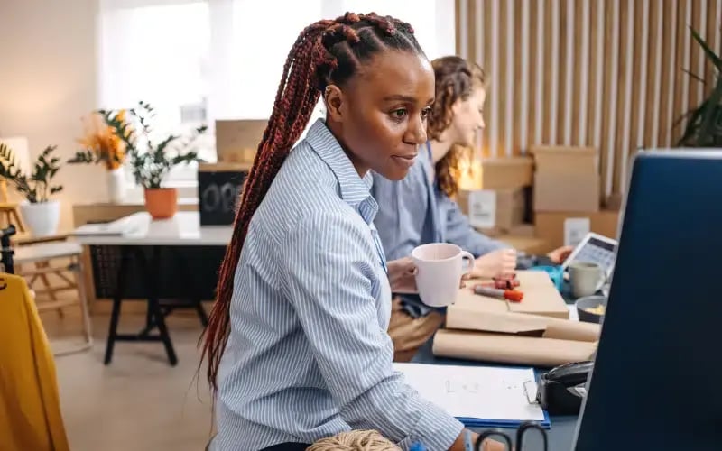 Small business owner working in her store