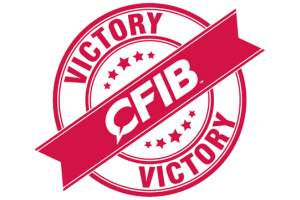 Red circular graphic showing the words CFIB Victory.