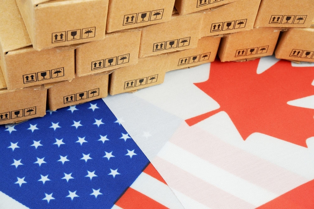 Canada and US flag surrounded by boxes.