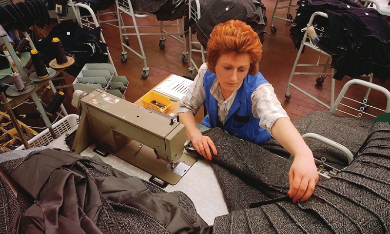woman at a textile plant sewing