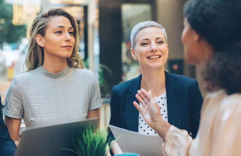 A group of businesswomen discussing together