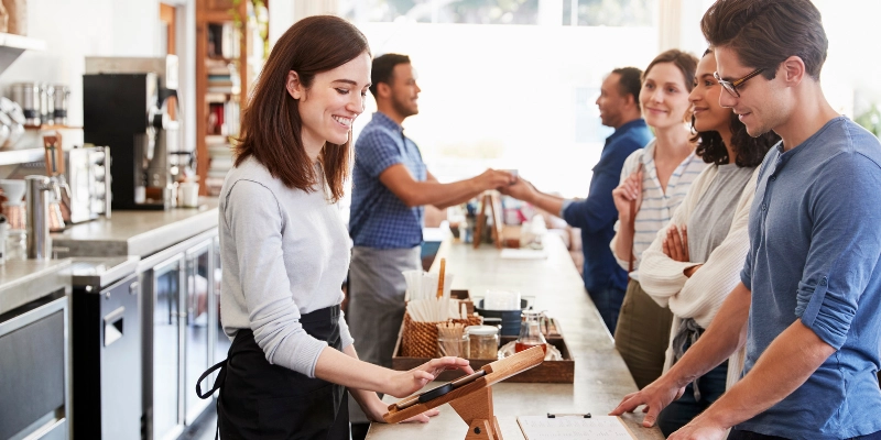 Barista helping customers