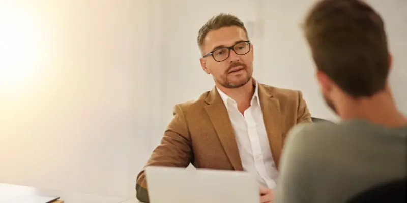 Manager discussing performance with employee