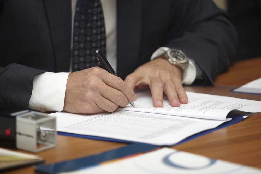 close up of businessman hands signing contract-1