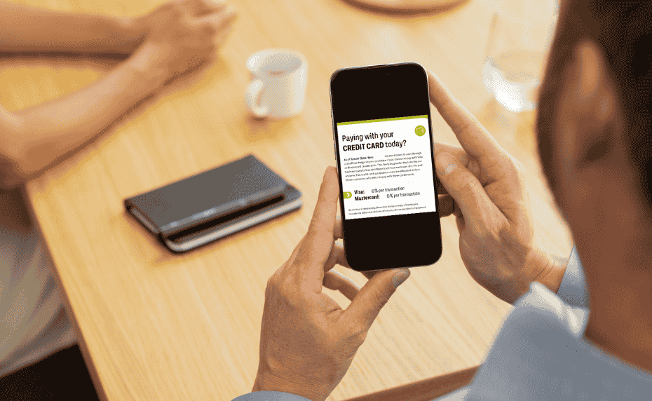 Small business owner reading CFIB's poster on his cellphone