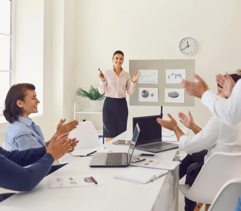 An employee of a small business is being recognized for her good performance