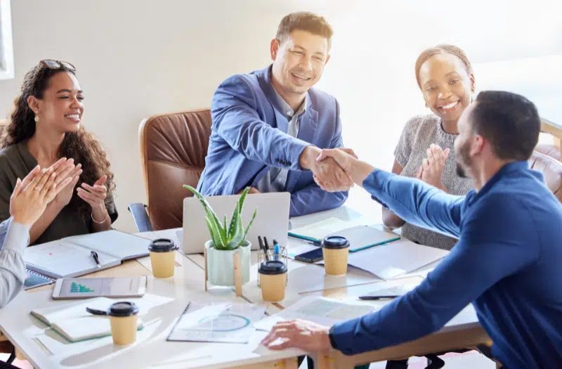 An employee of a small business company being recognized for his work