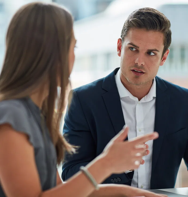 A small business owner is having a challenging work-related conversation with one of her employees