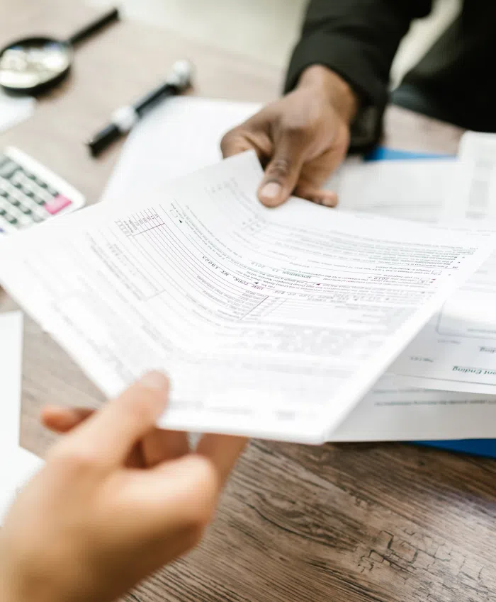 A small business owner is giving the ROE document to one of his employees