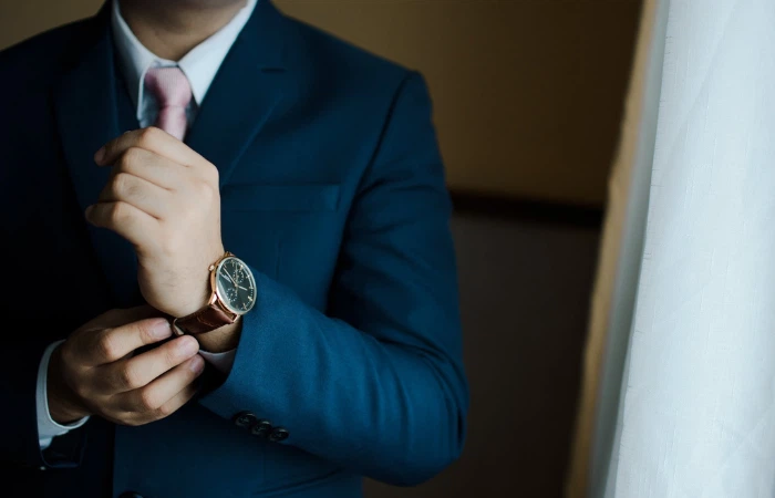 An employee of a small business company wearing his watch