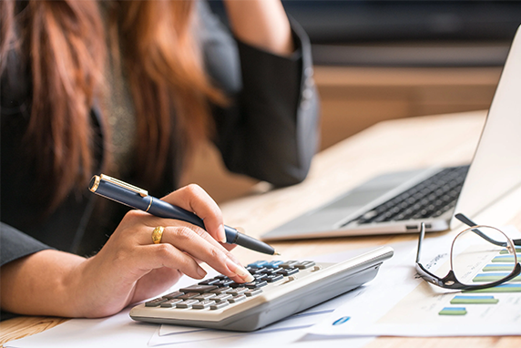 Business woman making calculations