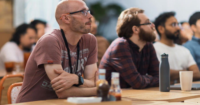 Group of people listening to a presentation