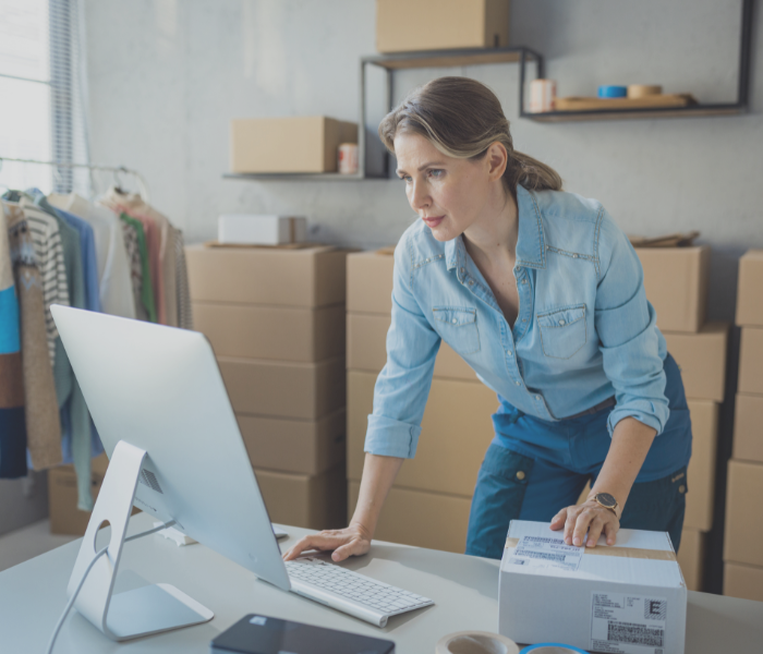 business owner on a computer representing doing corporate taxes