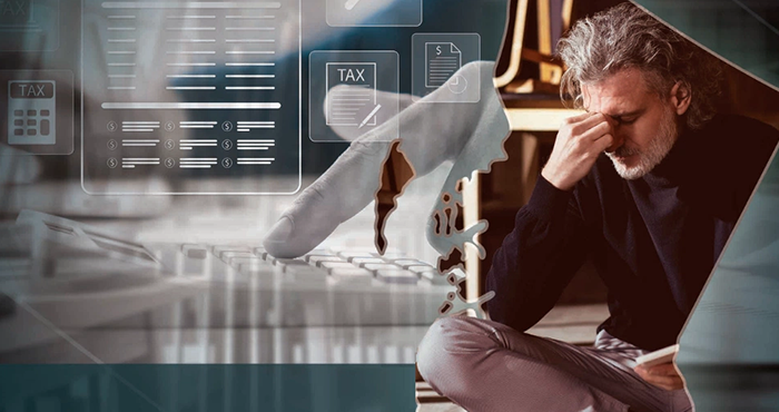 Frustrated man in BC surrounded by tax calculations and finance icons