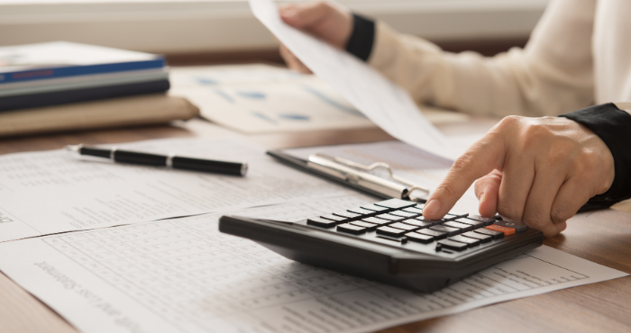 Person calculating payroll deductions