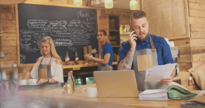 Small business owner talking on his cellphone