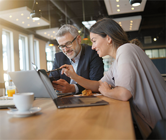 Two business workers having a meeting at a coffee shop