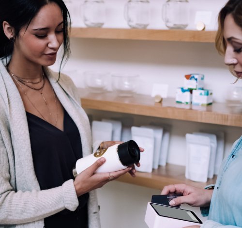 A Manitoban small business owner talkig with one of her customers