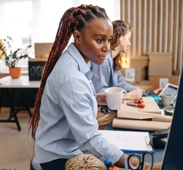 Small business owner working in her store