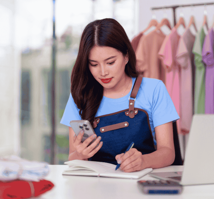 Small business owner working in her store