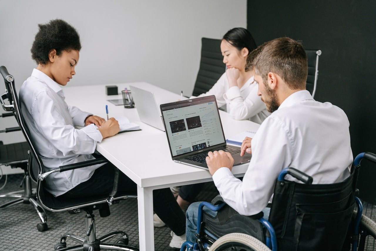 Diverse workers at a workplace table 