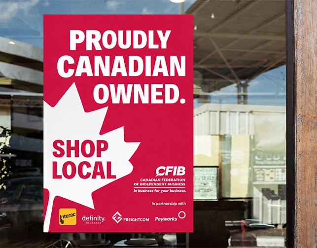 proudly Canadian owned poster in a storefront window